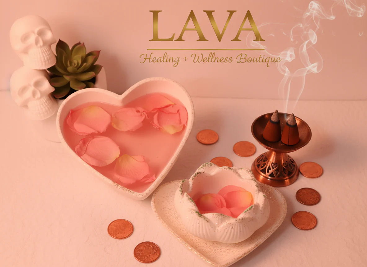 Rose petals, candles in heart holder